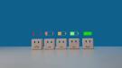 Fünf Würfel mit unterschiedlichen Smileys, darüber Batteriesymbole von leer zu voll.